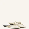 Mules Midnight Step Bow en piel metalizada