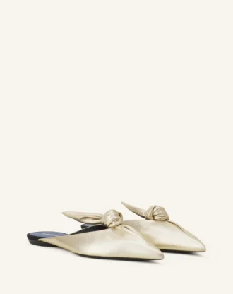 Mules Midnight Step Bow en piel metalizada Mules Midnight Step Bow en piel metalizada