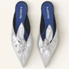 Mules Midnight Step Bow en piel metalizada