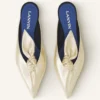 Mules Midnight Step Bow en piel metalizada